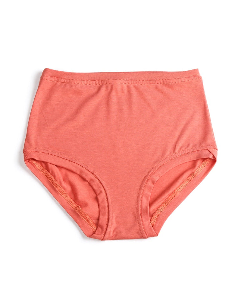 A pair of mid-rise terracotta-colored pants with a crossover finish at the legs, made from bamboo/cotton fabric.