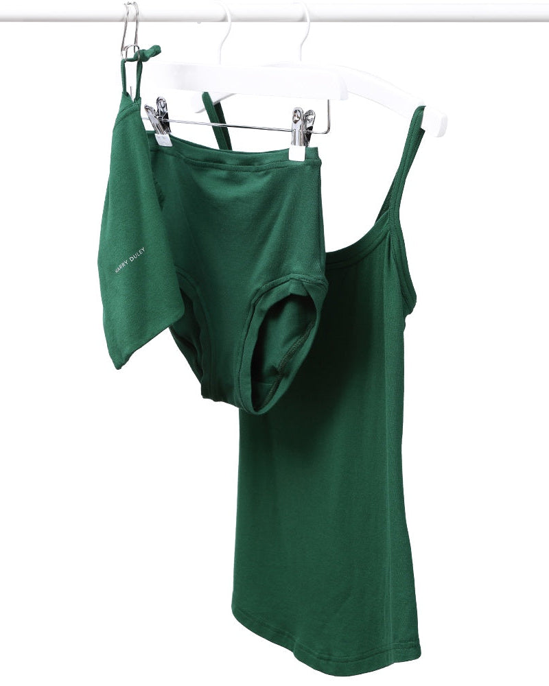 Emerald green strappy vest and pants set, displayed on hangers against a white background.